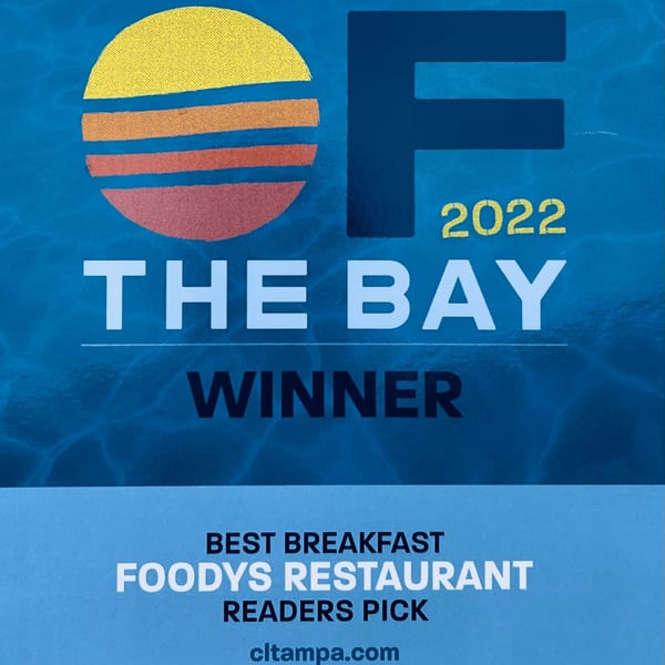 Foodys Tampa "Best Breakfast" award from "OF THE BAY" 2022, with a sun logo.